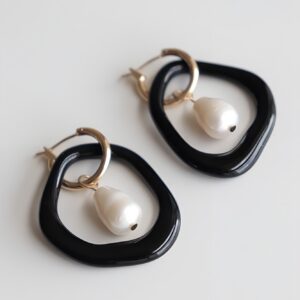 Boucles d'oreilles créoles Arp perle et porcelaine noir – Rozenthal